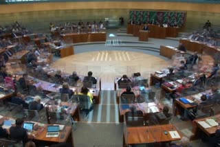 with the lawmakers separated by acrylic glass boxes in the Parliament session in Germany