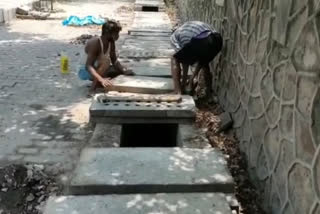 PWD is cleaning drains before arrival of monsoon in Munirka, Delhi.