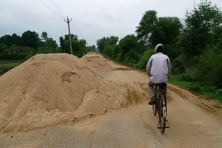 Sand is poured on the road