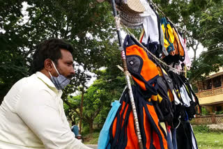 handicapped man selling mask in dharwad