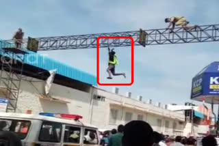 drunken man climbing flexi baricade in Tirupathi