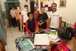 Parents lined up to get admission in a government school in Ghoghavdar village of Gondal