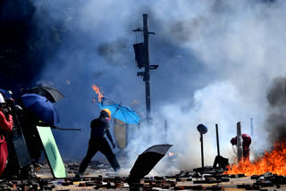 Hong Kong police arrest 180 protesters, 7 under new law