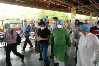 delhi bjp president inspect isolation coach at anand vihar terminal