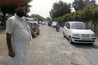 Potholes in Prahladpur village road in delhi