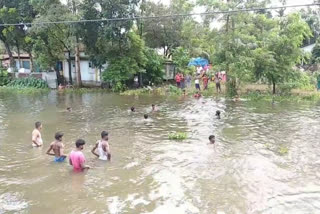 two boy mising a lake bilashipara