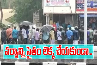 Heavy Rush in front of wine shops rain in vizag