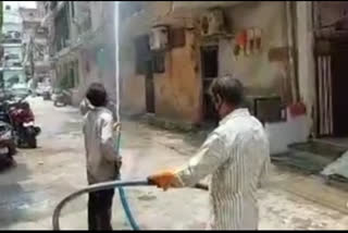 Spraying of sanitizer in block 19 in  Tilak Nagar