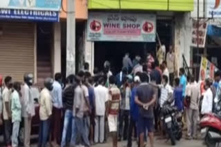 rush in visakha dst wine shops not maintain covid rules