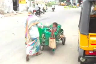 sweeper carries her in dustbin