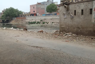 wall broken for drainage sanitation at jwalapuri in delhi
