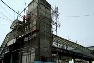 Construction of escalator damaged on foot over bridge on Raja Garden Road