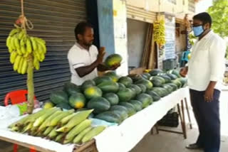 Owner of a tent house selling fruits