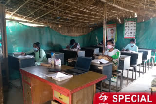 student taking tuition class in hut at yamuna khadar in delhi