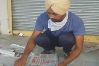 well educated Young Man sells newspapers in sangrur