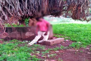 A young man commits suicide by hanging himself on a banyan tree