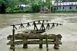 flood damaged a bridge in dhubri assam etv bharat news