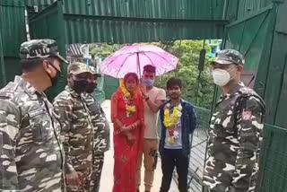 Indian groom returns home with Nepalese bride to a warm reception