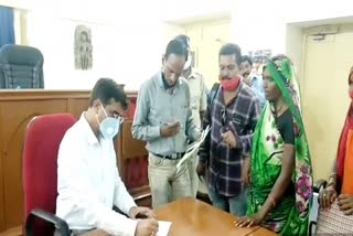 Tribal woman arrived to seek financial help from the collector