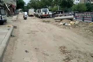 Dabri-Gurugram highway beside service lane road is in bad condition