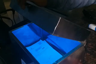 pressing paper at chandigarh passport office to avoid corona virus