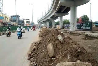 Risk of accident increased due to debris being collected on road in Nangli dairy area