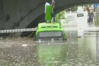 Fire Dept officials rescue people from a drowning bus