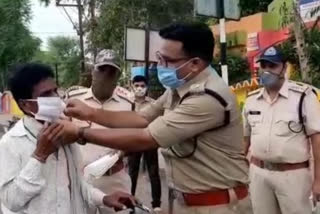 Superintendent of Police wearing mask with his hands