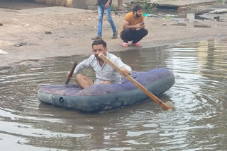 man seen on boat due to water logging at delhi saharanpur road in ghaziabad