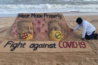 International SandArtist sudarshan pattnaik with a sand art shares message to wear mask properly