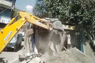 demolition drive in ganderbal, several shops demolished