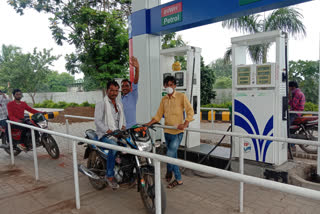 Iron railing mounted on petrol pump to follow social distancing