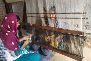 Women making silk thread