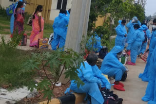 corona-victims- waiting in bus from mornig at eluru