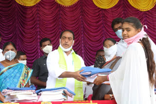 Minister Indira Reddy distributed textbooks to students at a government high school in Nirmal district