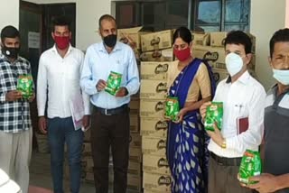 Asha Kumari distributed Nestle milk packets to children