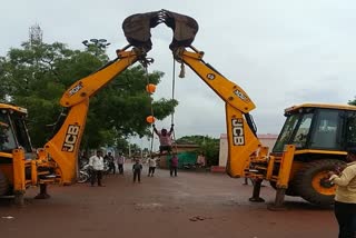 Villagers used two JCB vehicles to make swing as the celebration of Naga panchami festival