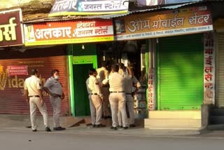 Policemen checking stationery shop