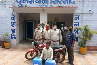 Motorcycle and accused arrested with illegal raw liquor