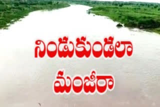 Heavy flood water in the Manjira River in medak district