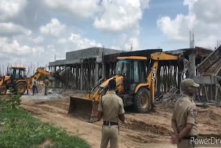 Authorities demolished illegal lay outs at rudraram in sangareddy district