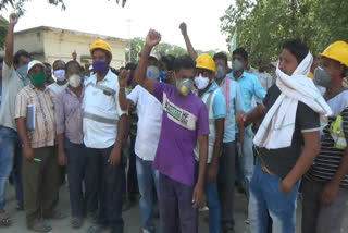 Workers in the cement factory are in hesitation