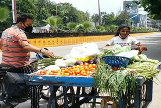 girl selling vegetables