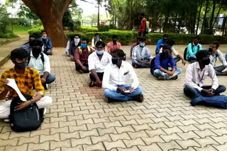Students protest in front of Tumkur University