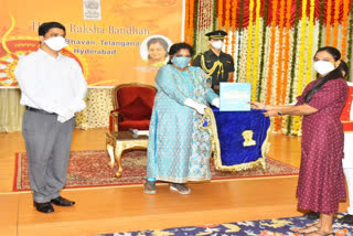 Governor tamilisai celebrating the rakhi festival with plasma donors at hyderabad