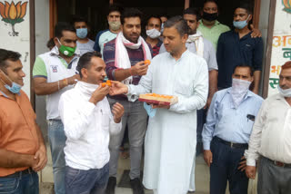 bjp mandal dharampur distributed sweets