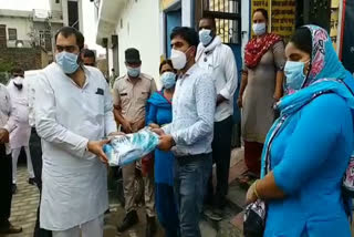 mask and sanitizer distributed in rewari on supreme court order