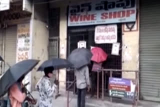 innovative thinking of  vijayawada police that people should stand with umbrellas to maintain social distance