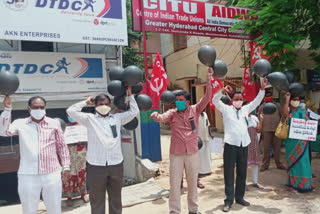 Cpm Protest With Black balloons And Demands Covid Tests Increased