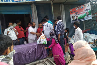 congress workers distribute ration to needy people at badarpur in delhi